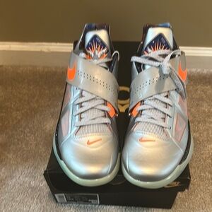 Nike Silver and Orange Athletic Shoes with Shark Tooth Design